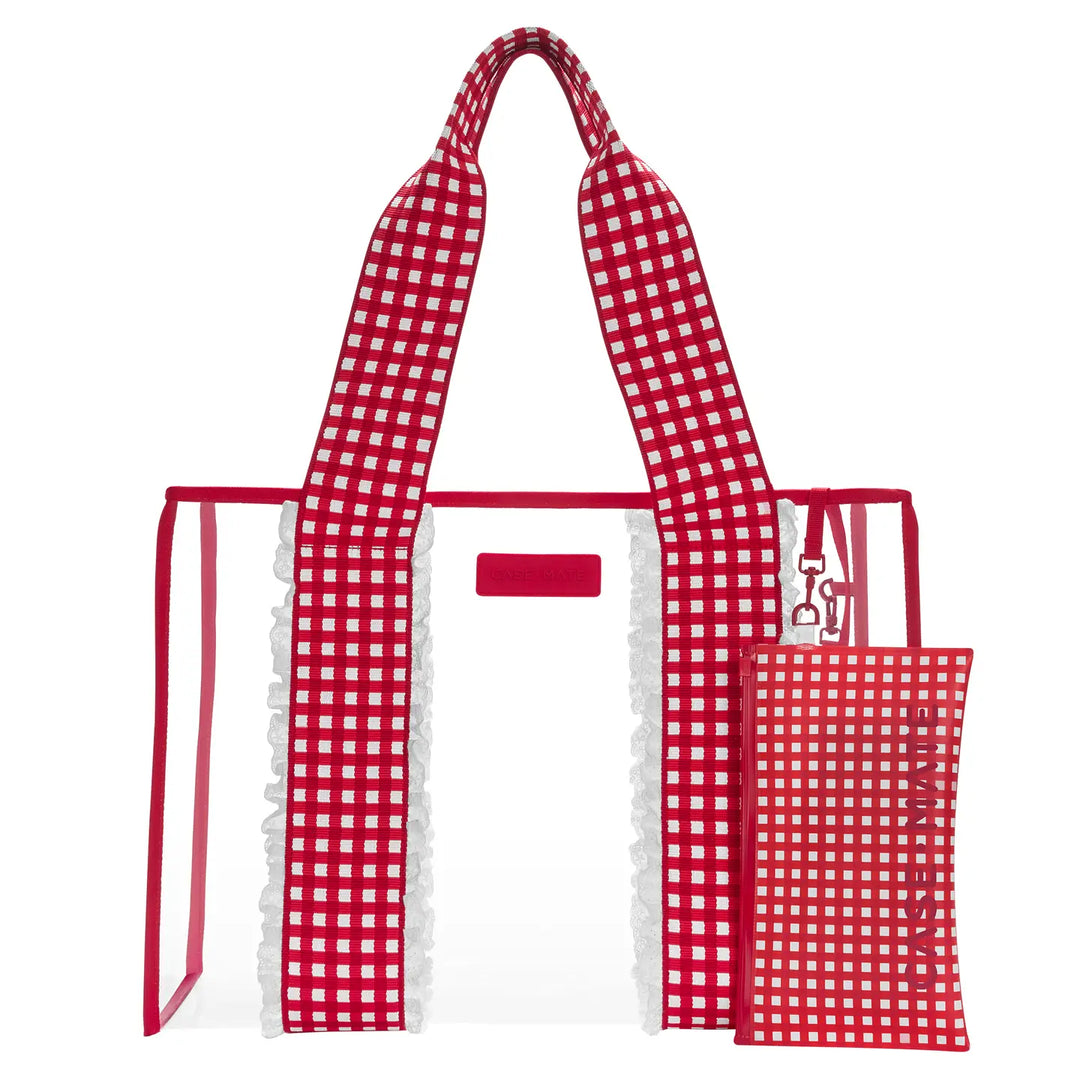 A clear tote bag with red and white gingham patterned handles and trim, white ruffled trim along the sides, and a matching small pouch attached on the right side, shown on a plain white background.