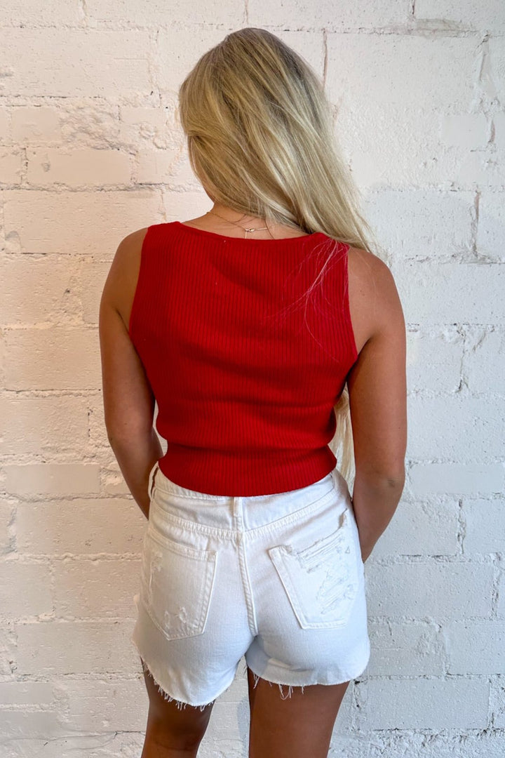 Available in red and navy
Detailed knot accents along the neckline
Soft, comfortable knit fabric
Relaxed fit for a flattering silhouette
