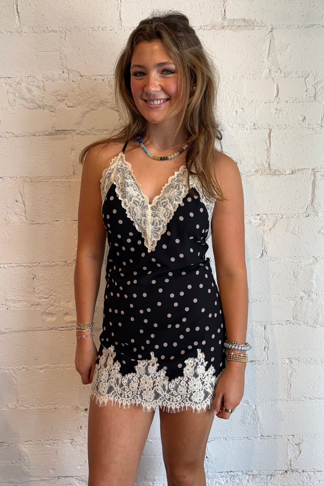 Black polka dot lace mini dress with tie back