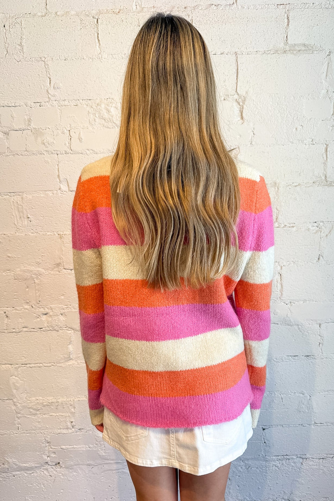 Orange women’s sweater styled for college gameday