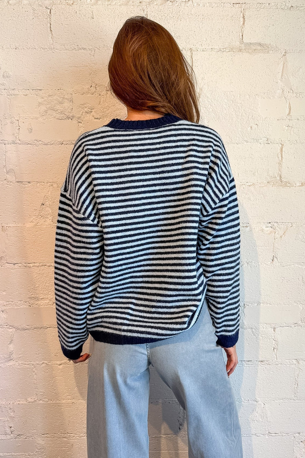 Women’s navy knit sweater with relaxed fit